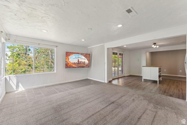 1388 S 1300 E, Salt Lake City, UT 84105 - unfurnished living room featuring french doors, carpet, baseboards, and recessed lighting