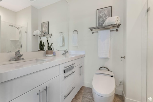 bathroom featuring a shower stall, toilet, double vanity, and tile patterned flooring