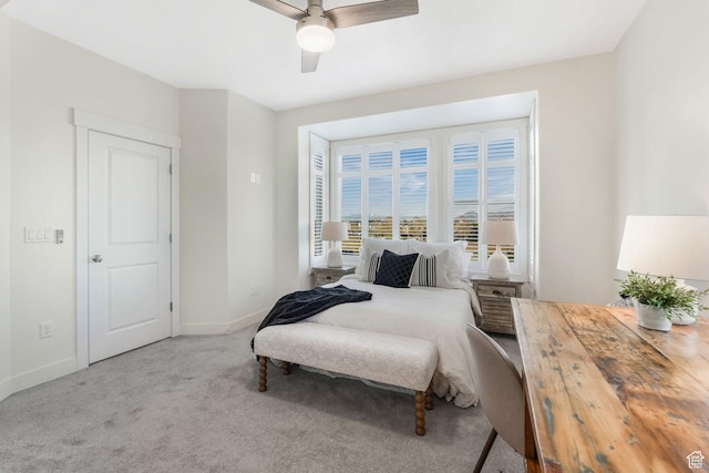 bedroom with baseboards, carpet flooring, and ceiling fan