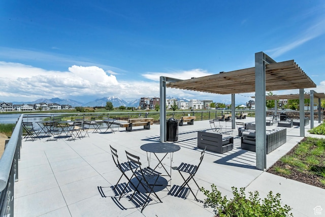 view of patio / terrace with an outdoor hangout area and a mountain view