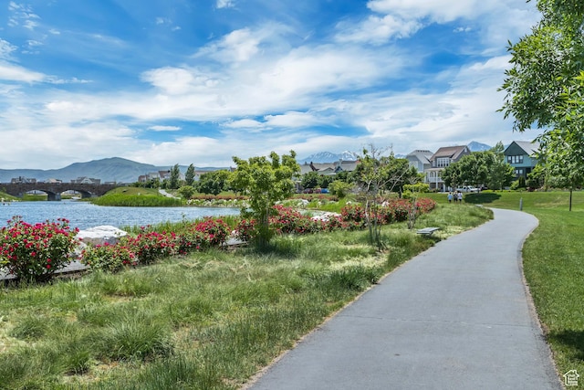 view of community featuring a water and mountain view and a residential view