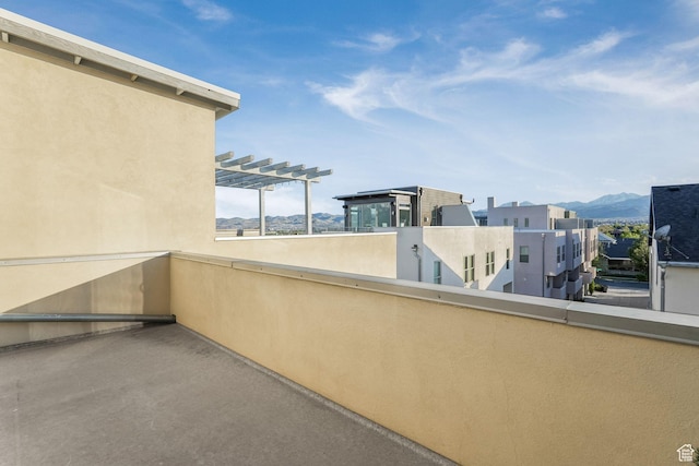 balcony with a pergola and a mountain view