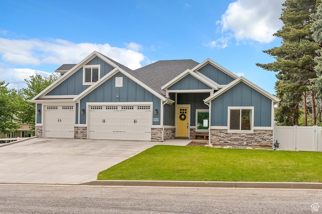 2685 N 850 E, North Ogden, UT 84414 - craftsman-style house featuring board and batten siding, stone siding, concrete driveway, and a shingled roof