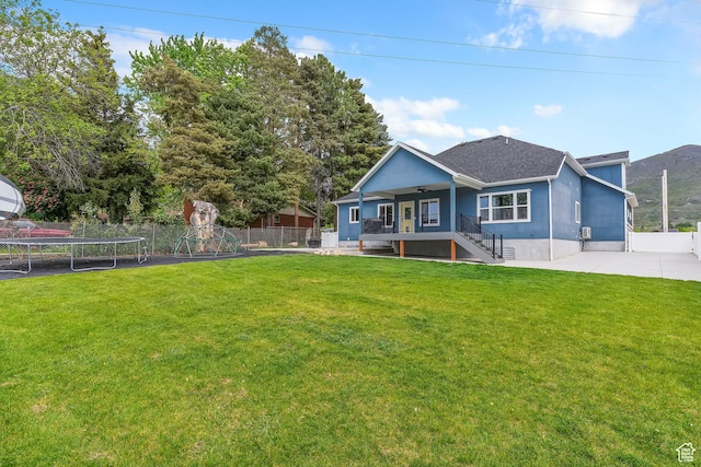 2685 N 850 E, North Ogden, UT 84414 - rear view of house featuring a trampoline, ceiling fan, stairs, and a shingled roof