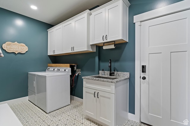 2685 N 850 E, North Ogden, UT 84414 - clothes washing area featuring washer and dryer, baseboards, cabinet space, and light floors