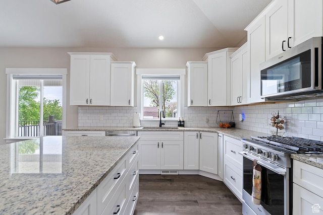 2685 N 850 E, North Ogden, UT 84414 - kitchen with stainless steel appliances, a sink, white cabinetry, recessed lighting, and dark wood finished floors