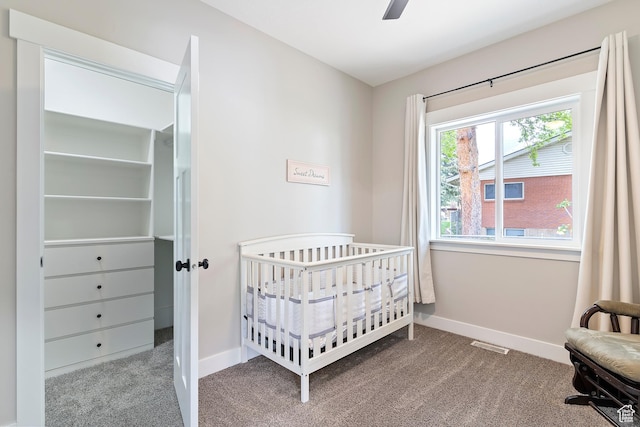 2685 N 850 E, North Ogden, UT 84414 - carpeted bedroom featuring baseboards, a nursery area, and a ceiling fan