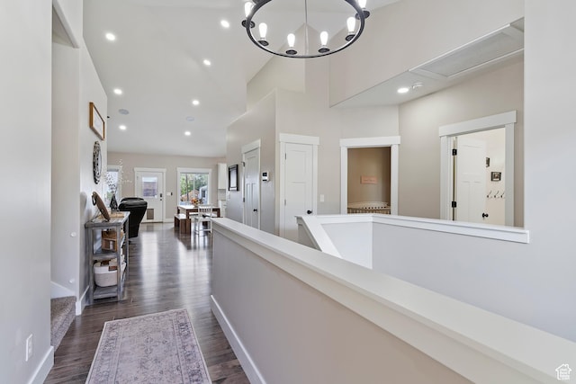 2685 N 850 E, North Ogden, UT 84414 - hallway with dark wood-style floors, baseboards, a high ceiling, recessed lighting, and a chandelier