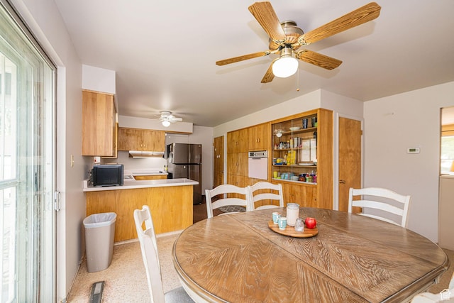 dining space featuring ceiling fan
