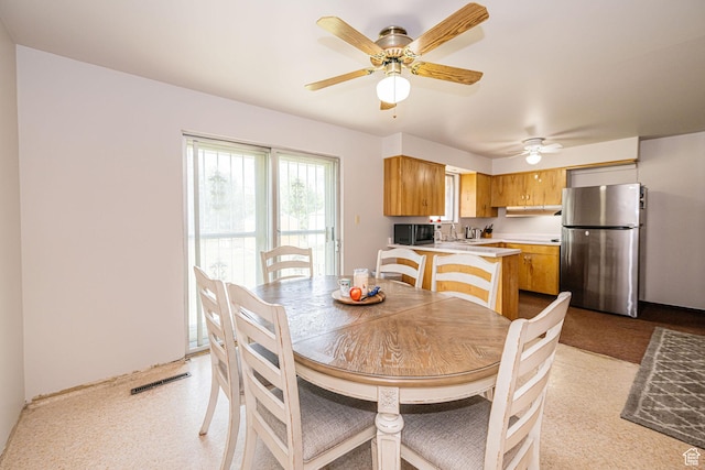 dining space featuring ceiling fan