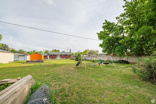 view of yard featuring a storage unit and an outdoor structure