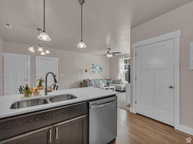 14642 S Mckellen Dr Unit 201, Herriman, UT 84096 - kitchen featuring dishwasher, a sink, dark brown cabinets, light wood-type flooring, and pendant lighting