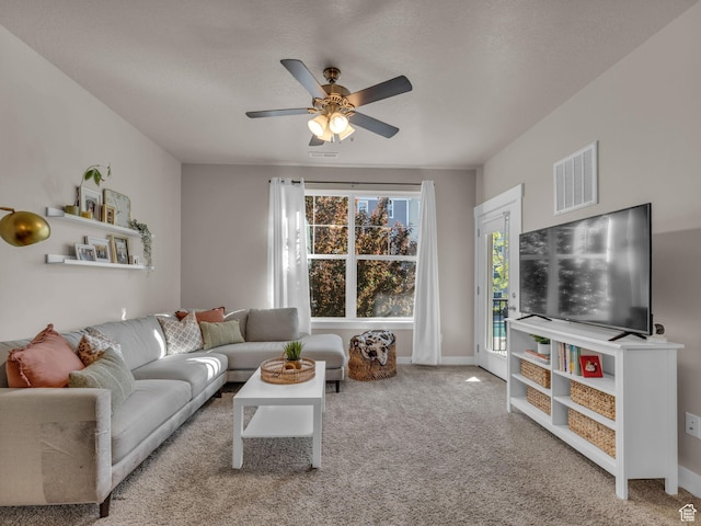 14642 S Mckellen Dr Unit 201, Herriman, UT 84096 - living room with carpet flooring, a ceiling fan, and baseboards