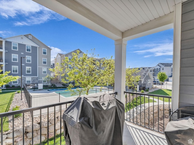 14642 S Mckellen Dr Unit 201, Herriman, UT 84096 - balcony featuring area for grilling, view of pool area, and a residential view