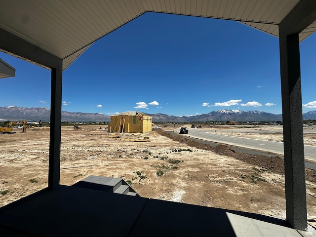view of yard with a mountain view and a patio