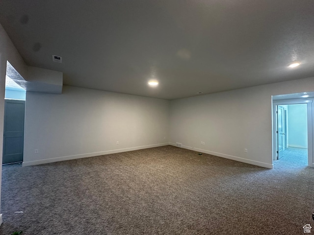 carpeted spare room with baseboards and recessed lighting