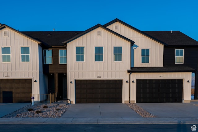 1579 N 800 W, Salem, UT 84653 - view of front of house featuring board and batten siding, an attached garage, concrete driveway, and a shingled roof