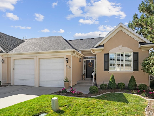 11834 S Cottage View Ln, Draper, UT 84020 - view of front facade featuring a garage, concrete driveway, a front yard, stucco siding, and roof with shingles