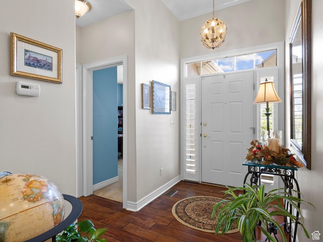 11834 S Cottage View Ln, Draper, UT 84020 - entryway with dark wood-type flooring, a chandelier, baseboards, and ornamental molding