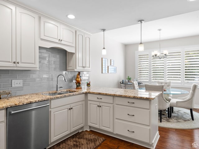11834 S Cottage View Ln, Draper, UT 84020 - kitchen with stainless steel dishwasher, a sink, a peninsula, backsplash, and dark wood finished floors