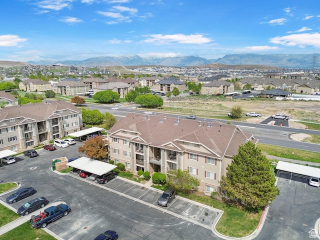 aerial view of residential area featuring a mountain backdrop