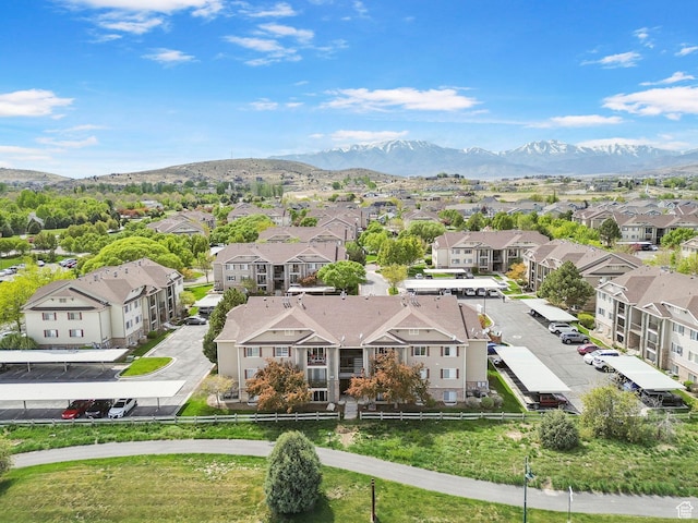 aerial view of residential area featuring mountains