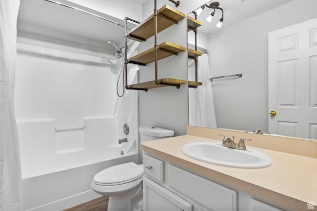 full bathroom with toilet, wood finished floors, vanity, and shower / bath combination with curtain