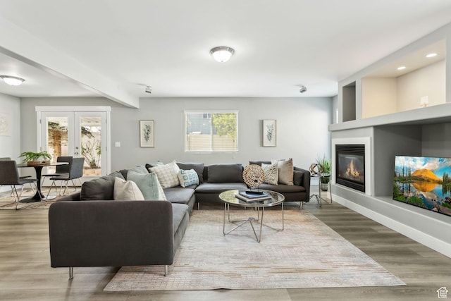 8392 S Oak Vista Dr, West Jordan, UT 84081 - living room featuring plenty of natural light, a glass covered fireplace, wood finished floors, recessed lighting, and beamed ceiling