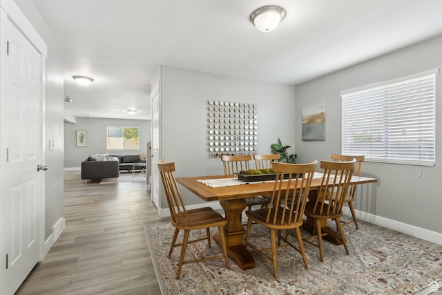 8392 S Oak Vista Dr, West Jordan, UT 84081 - dining area with baseboards and light wood finished floors