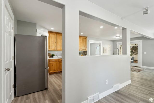 8392 S Oak Vista Dr, West Jordan, UT 84081 - kitchen featuring freestanding refrigerator, light wood finished floors, recessed lighting, baseboards, and light countertops