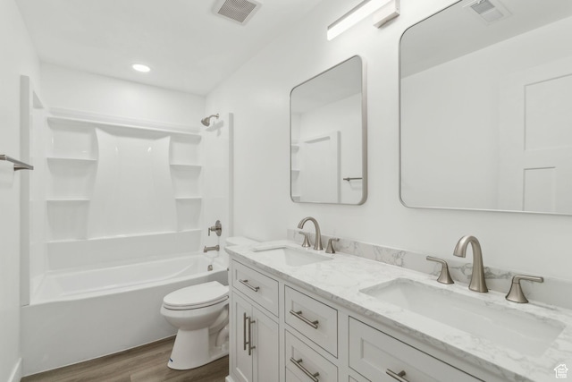 8392 S Oak Vista Dr, West Jordan, UT 84081 - bathroom featuring wood finished floors, toilet, double vanity, shower / tub combination, and recessed lighting