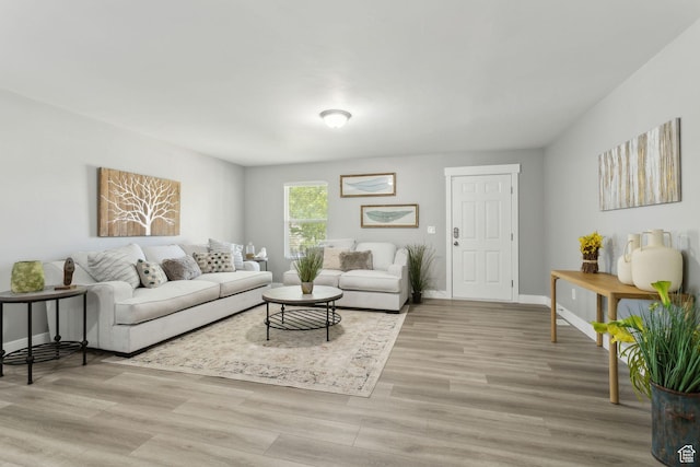 8392 S Oak Vista Dr, West Jordan, UT 84081 - living area featuring light wood-style floors and baseboards