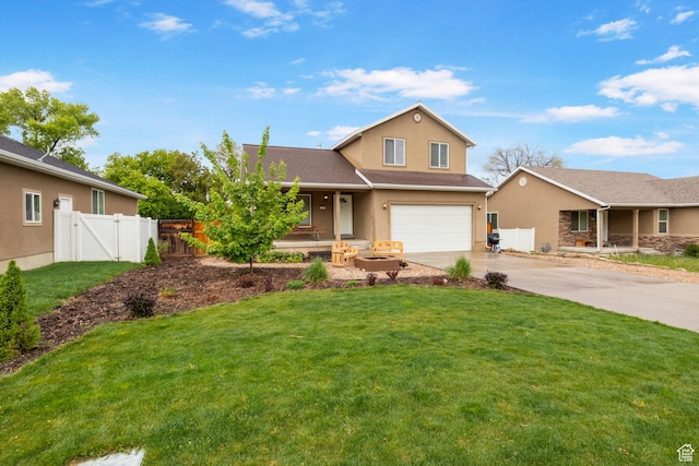 traditional home featuring a garage, concrete driveway, stucco siding, a gate, and a porch
