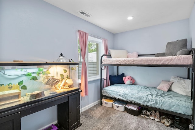 bedroom featuring carpet and baseboards