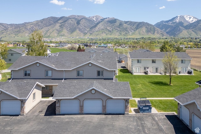 view of mountain backdrop with nearby suburban area
