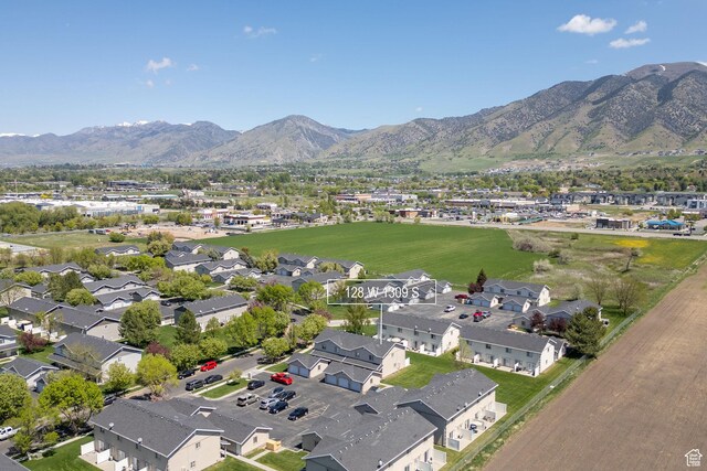 aerial view of residential area featuring a mountainous background