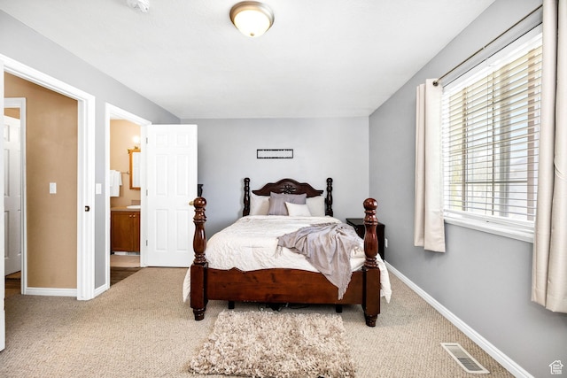 bedroom featuring carpet floors and baseboards