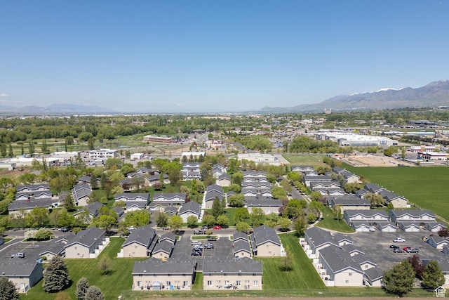 aerial view of property's location featuring mountains and nearby suburban area
