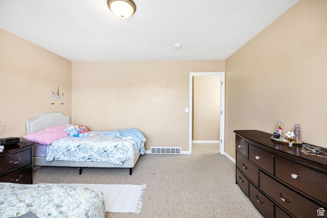 bedroom featuring carpet floors and baseboards