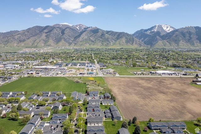 aerial view of property's location with nearby suburban area and mountains