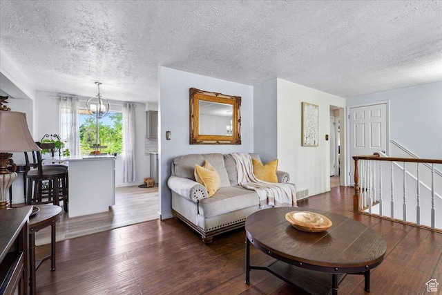 1471 W 1460 N, Provo, UT 84604 - living area featuring a chandelier, a textured ceiling, and hardwood / wood-style floors
