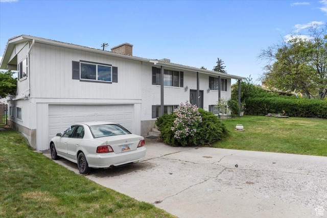 1471 W 1460 N, Provo, UT 84604 - raised ranch with concrete driveway, a chimney, an attached garage, and a front lawn