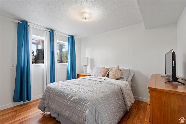 1471 W 1460 N, Provo, UT 84604 - bedroom featuring a textured ceiling, wood finished floors, and baseboards