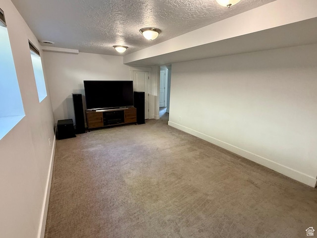 9977 S Lannae Dr E, Sandy, UT 84094 - unfurnished living room with a textured ceiling, baseboards, and light carpet