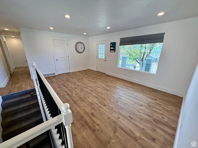 9977 S Lannae Dr E, Sandy, UT 84094 - foyer entrance featuring wood finished floors, recessed lighting, and baseboards