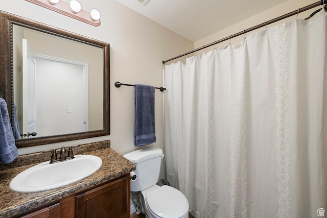 full bath with toilet and vanity
