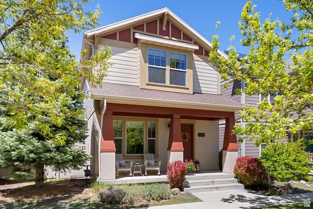 view of front of house featuring a porch and roof with shingles