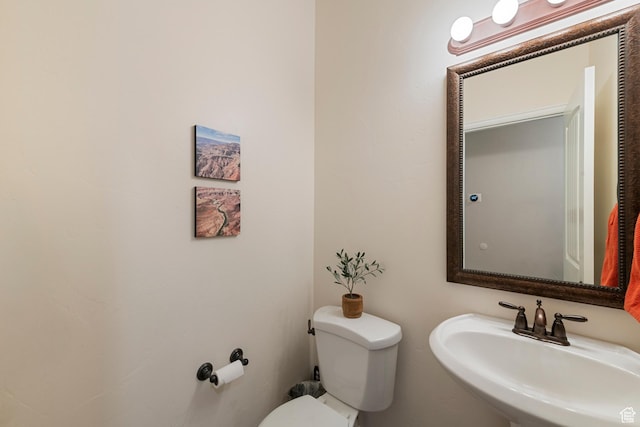 bathroom featuring a sink and toilet