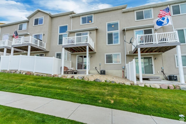 14397 S Hill Shadow Way Unit 87, Herriman, UT 84096 - back of house with stucco siding and a lawn