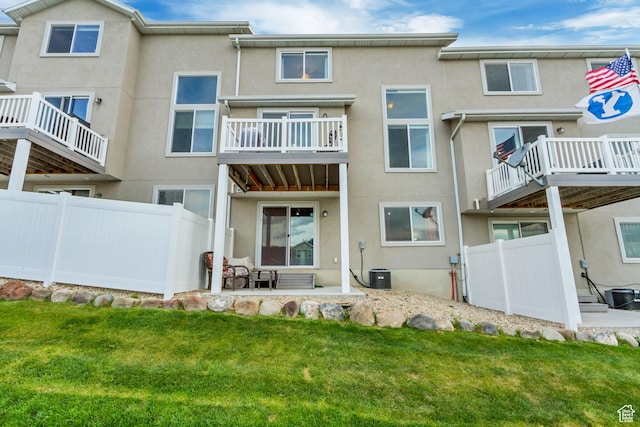 14397 S Hill Shadow Way Unit 87, Herriman, UT 84096 - rear view of house with stucco siding, central air condition unit, and a balcony